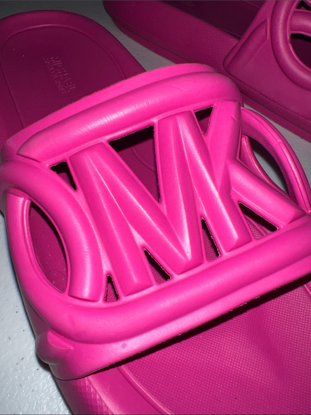 Michael Kors Splash Slide sandals in a bright cerise pink color. - Picture 3 of 6
